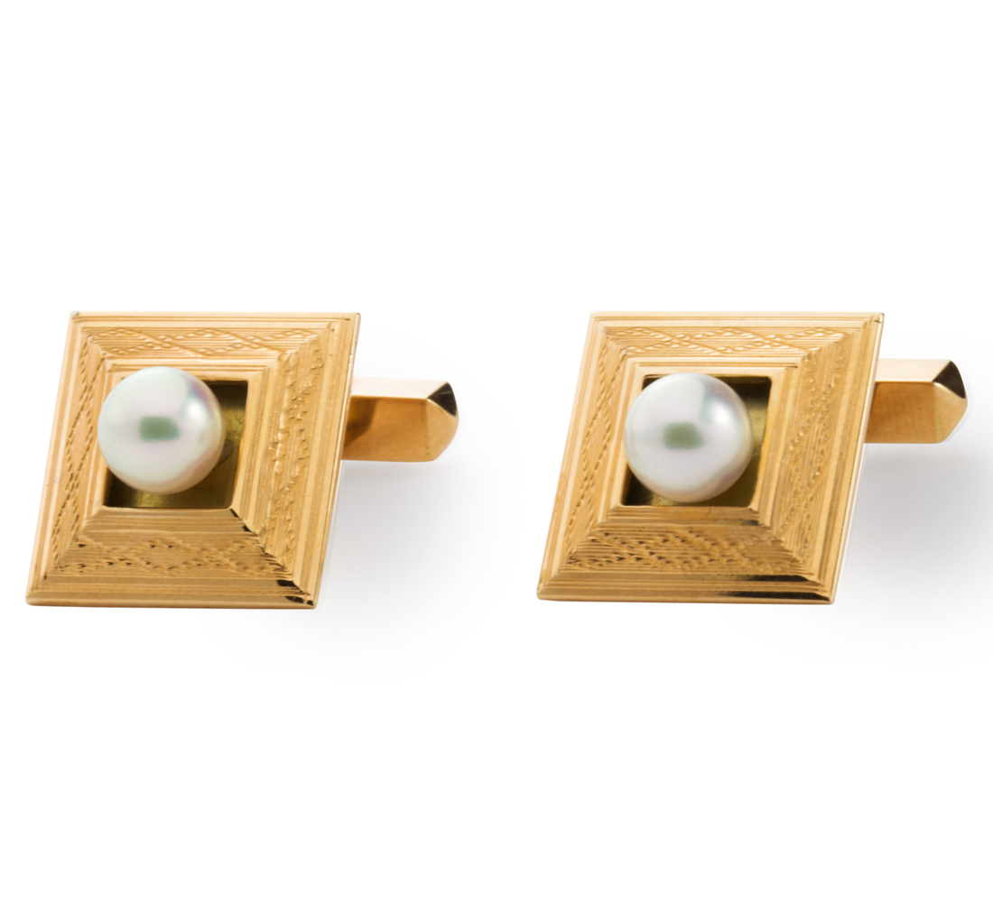 Appraisal: A PAIR OF CULTURED PEARL AND EIGHTEEN KARAT GOLD CUFF