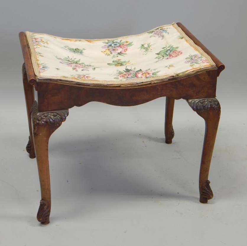 Appraisal: An early thC walnut dressing stool on flower carved cabriole