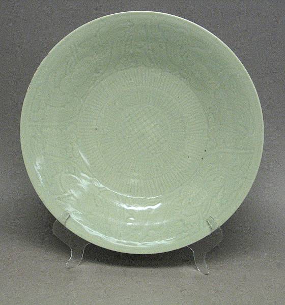 Appraisal: A celadon glazed porcelain charger th Century With carved flower