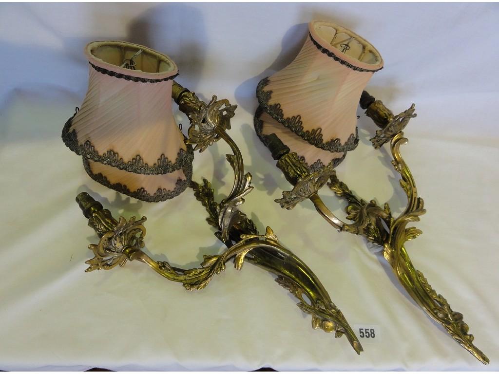 Appraisal: A pair of Rococo style gilt wall lights two scrolled