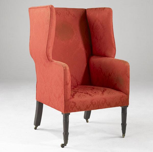 Appraisal: ENGLISH WING CHAIR Upholstered in red silk on casters th