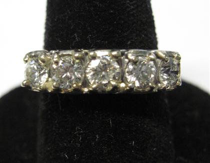 Appraisal: Platinum and diamond band ringSet with five round cut diamonds