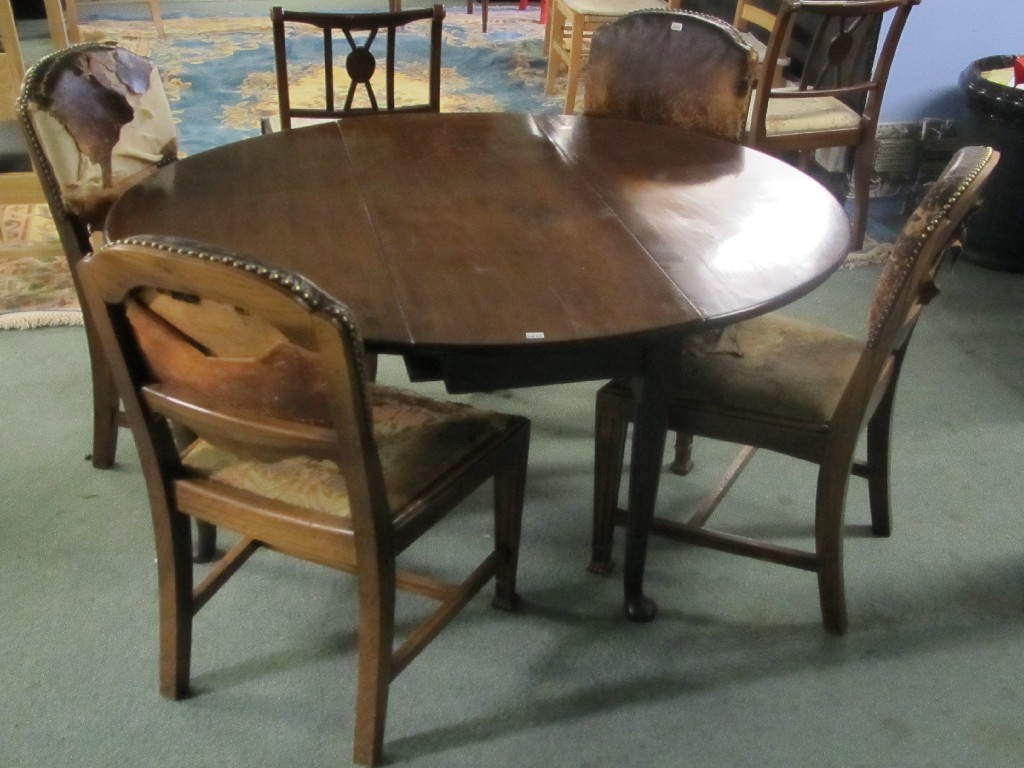 Appraisal: Edwardian mahogany drop leaf dining table with four Edwardian dining