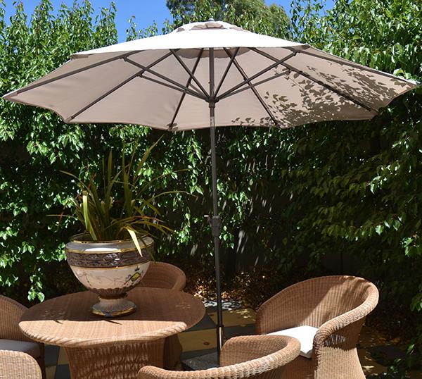 Appraisal: AN OUTDOOR UMBRELLA WITH A TELESCOPIC STAND CM HIGH