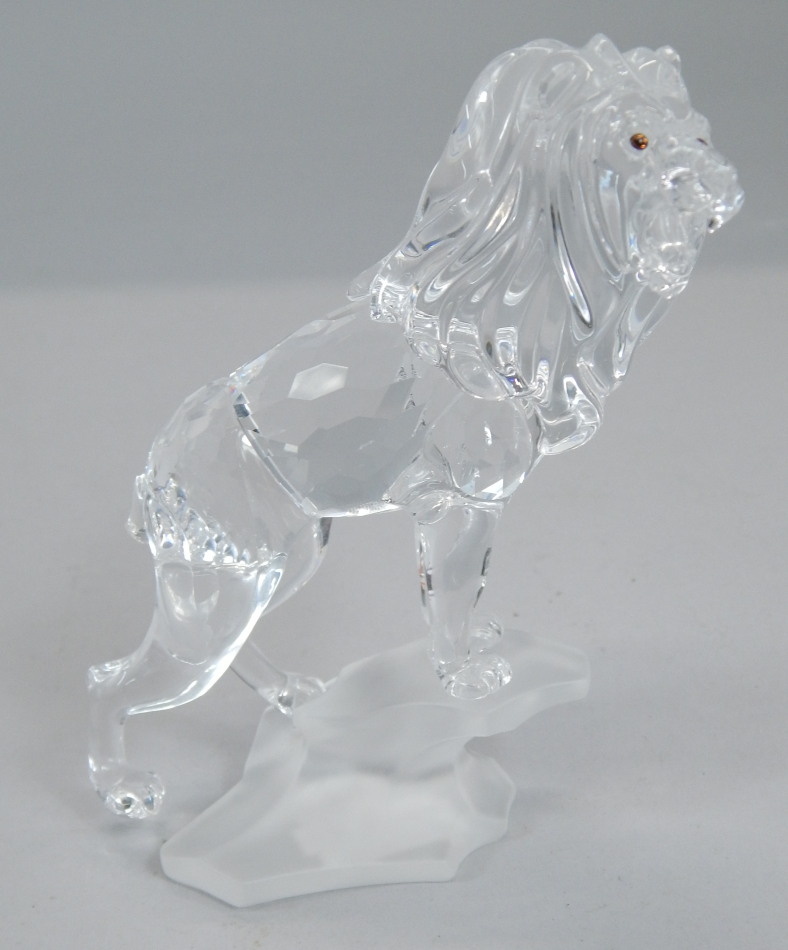 Appraisal: A Swarovski crystal model of a lion standing on a