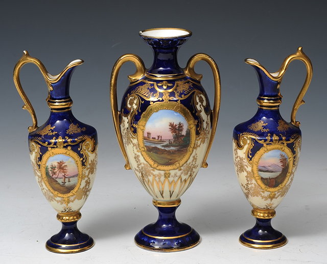 Appraisal: A CONTINENTAL PORCELAIN GARNITURE OF A CENTRAL TWO HANDLED VASE