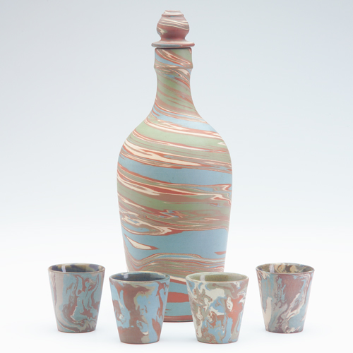 Appraisal: NILOAK Mission ware cordial set with a stoppered bottle and