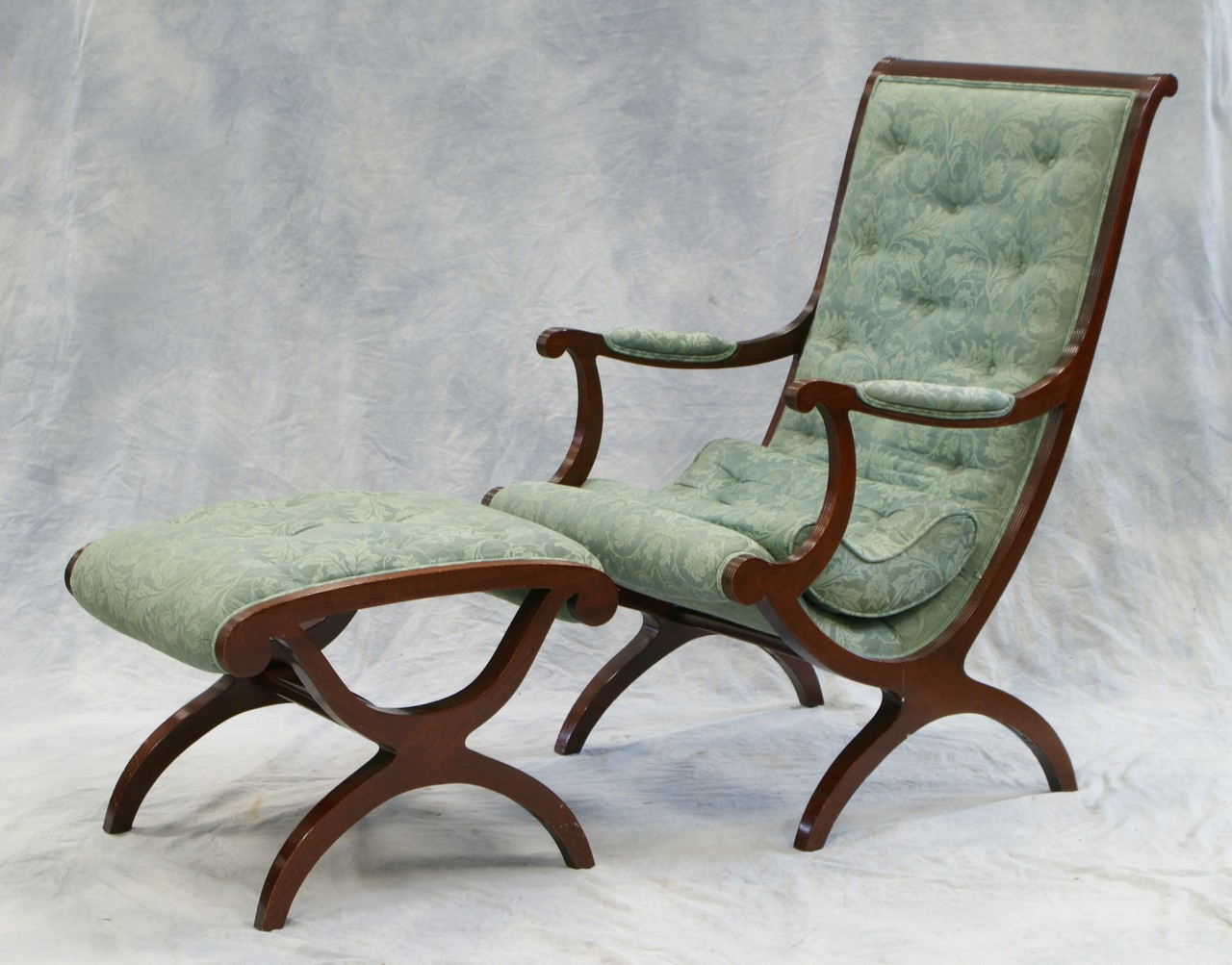 Appraisal: Mahogany Federal style campaign chair with matching footstool by Kindel