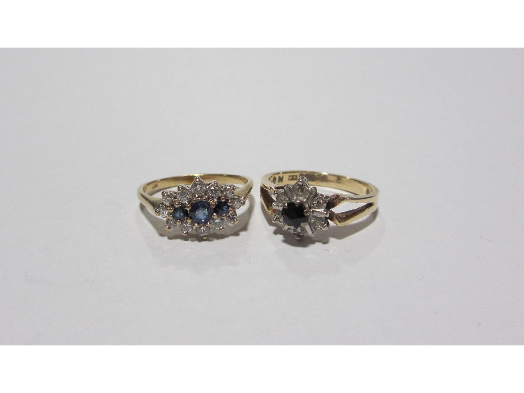 Appraisal: Lot comprising two ct gold sapphire and diamond cluster rings