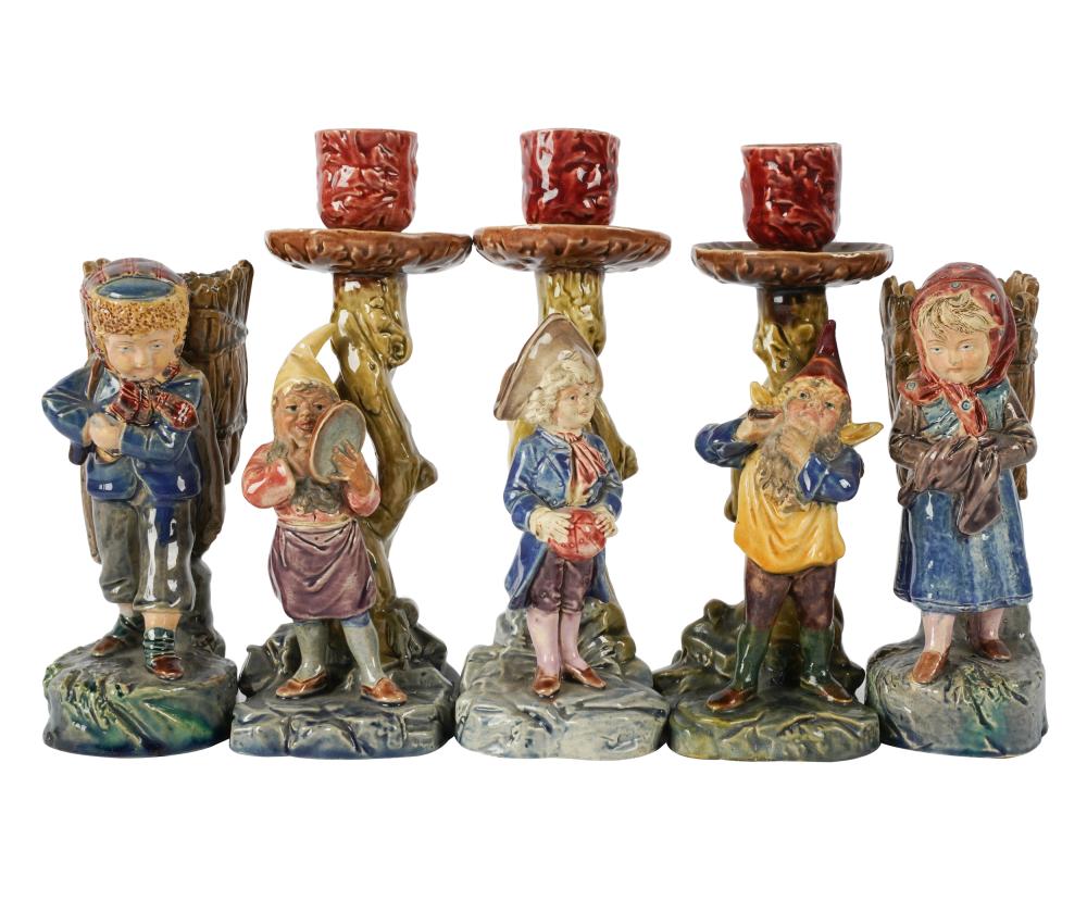 Appraisal: GROUP OF MAJOLICA FIGURES CANDLESTICKSeach impressed BU comprising a pair