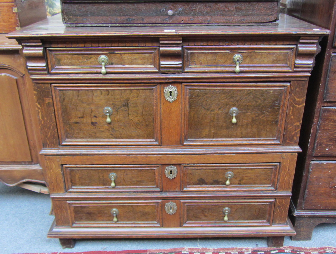 Appraisal: A William and Mary oak chest of four long graduated