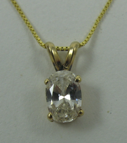 Appraisal: DIAMOND PENDANT NECKLACE WITH APPRAISAL K yellow gold setting and