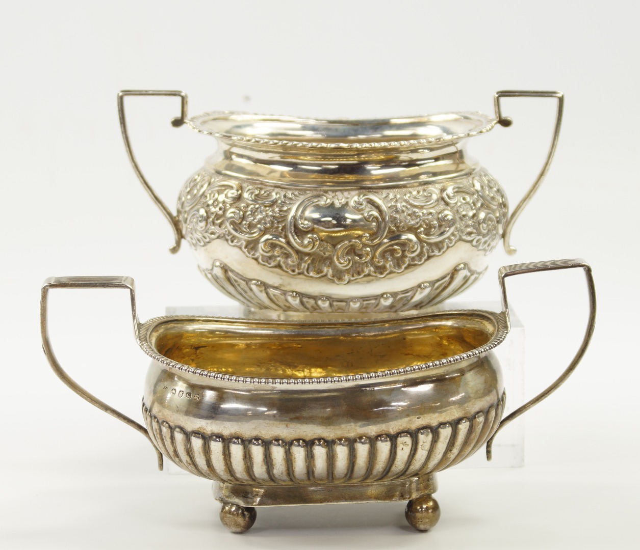 Appraisal: A George III silver twin handled semi-fluted sugar bowl London