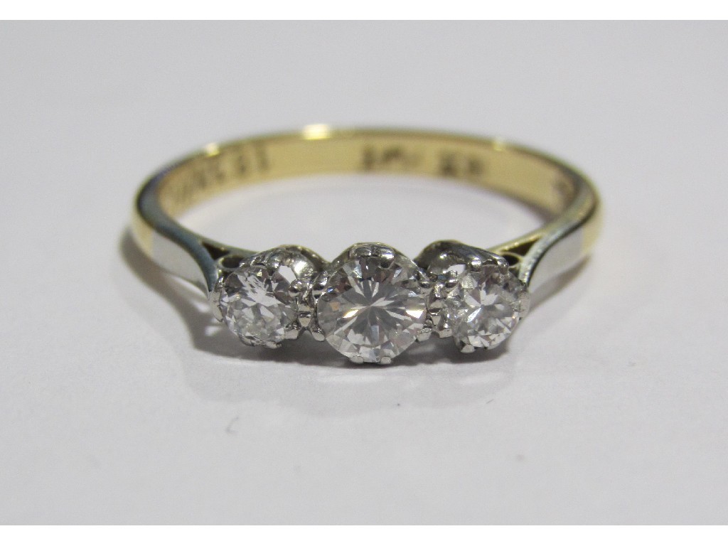 Appraisal: An eighteen carat gold diamond three stone ring with three