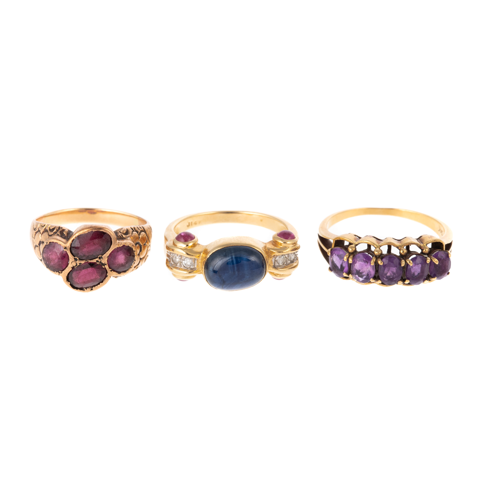 Appraisal: A TRIO OF GEMSTONE RINGS IN K K yellow gold