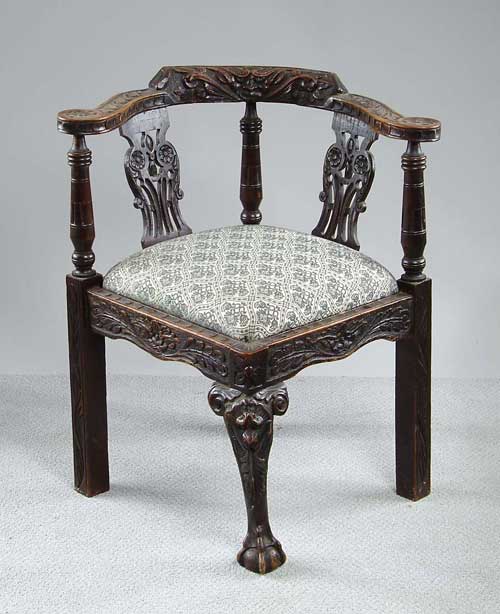 Appraisal: ENGLISH CARVED OAK CORNER CHAIR Carving throughout including wind blower