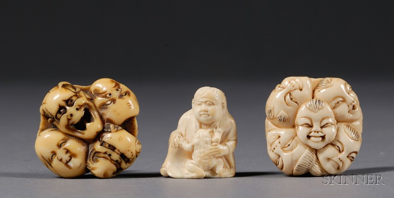 Appraisal: Three Ivory Netsuke two mask groupings and a seated figure