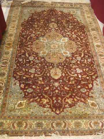 Appraisal: Persian Handmade Silk Rug Tabriz style elaborate florals deep red