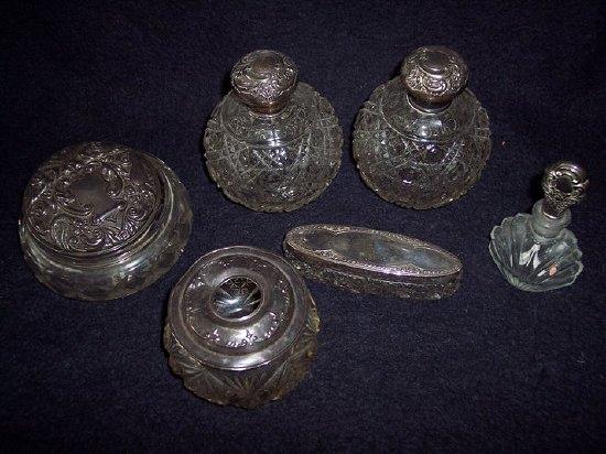 Appraisal: A quantity of silver mounted scent bottles jars etc