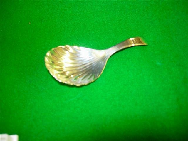 Appraisal: A GEORGE III SHELL PATTERN CADDY SPOON London maker E