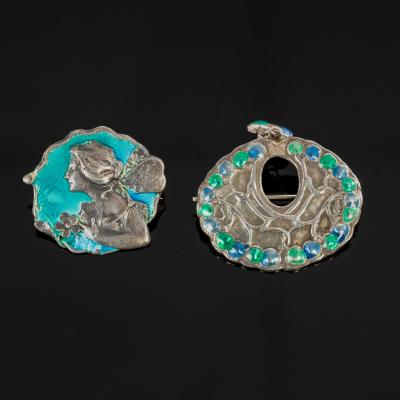 Appraisal: A silver and enamel brooch of Art Nouveau design depicting