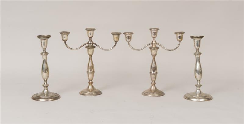 Appraisal: PAIR OF HUNT-HALLMARK WEIGHTED SILVER CANDLESTICKS AND A PAIR OF