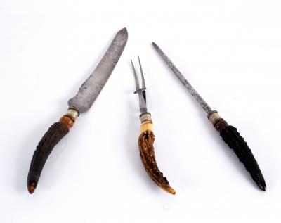 Appraisal: A three-piece carving set with antler handles the knife blade