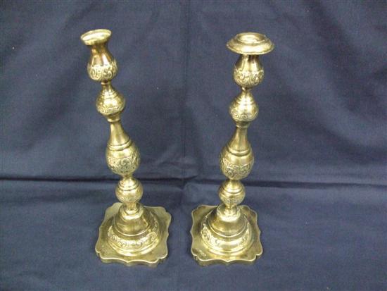 Appraisal: Pair of George V silver baluster candlesticks with chased decoration