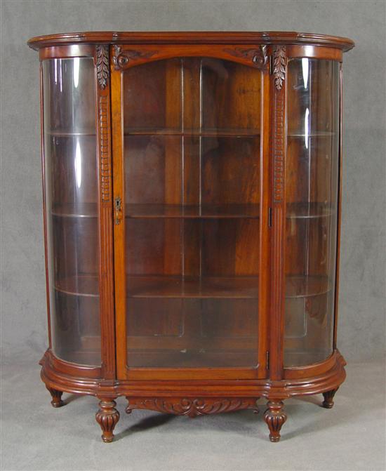 Appraisal: Walnut Edwardian China Cabinet Early th Century Arched carved door