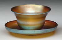 Appraisal: TIFFANY FINGER BOWL UNDERPLATE Iridescent gold finish with blue and