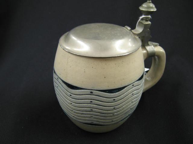 Appraisal: German Pottery Stein salt-glaze wave design liter tight hairline