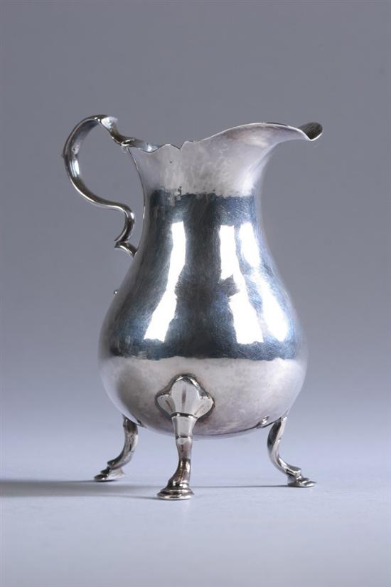 Appraisal: GEORGE II SILVER CREAMER WS London Plain pear-shaped body raised