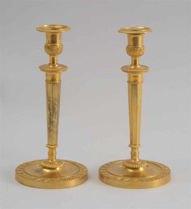 Appraisal: PAIR OF EMPIRE GILT-BRONZE CANDLESTICKS Each octagonal tapered stem with