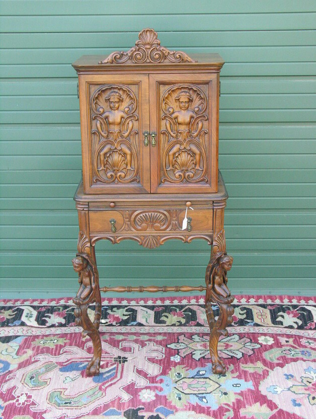 Appraisal: FIGURAL CARVED NUDES TELEPHONE CABINET Circa 's Walnut Size by