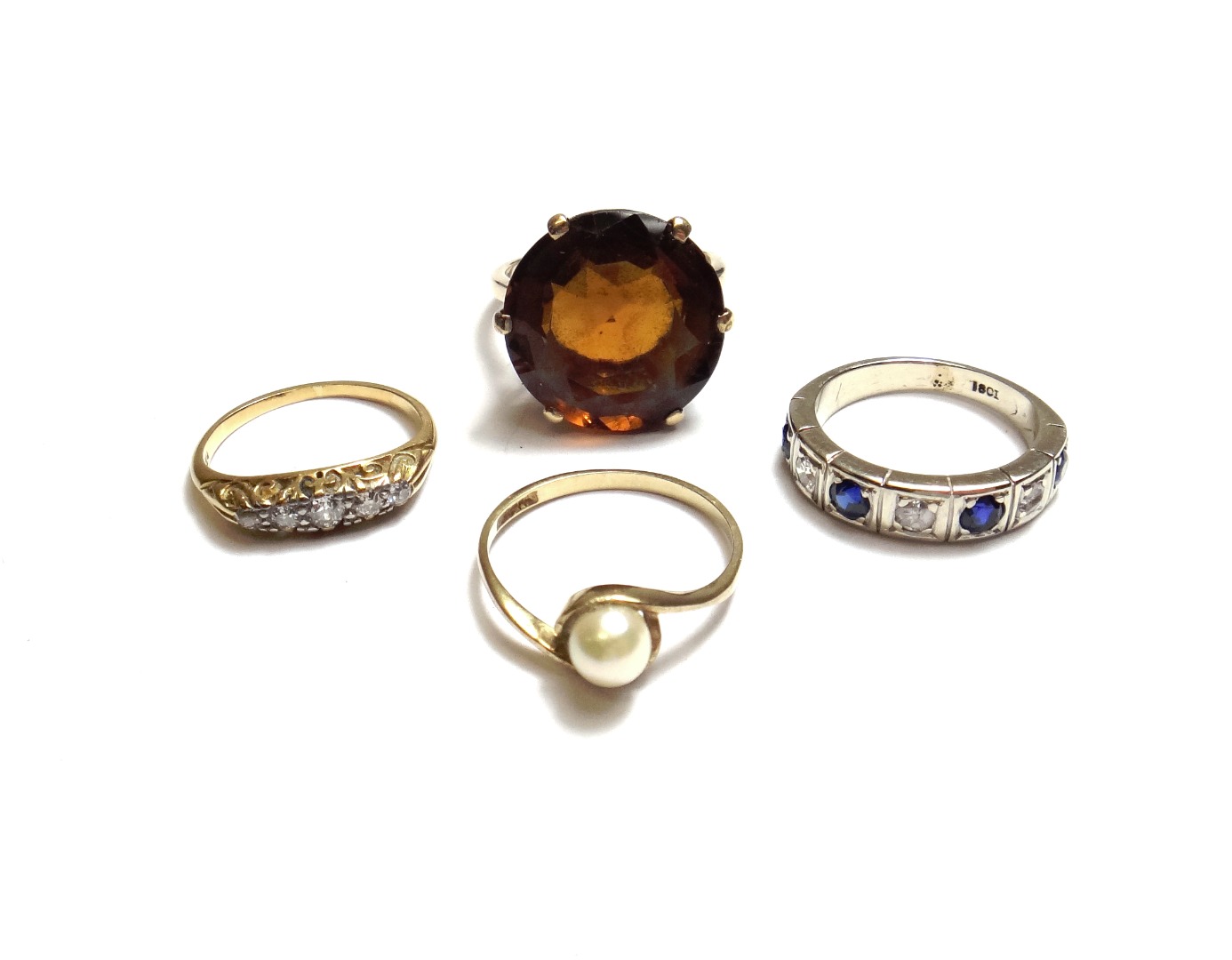 Appraisal: A gold and diamond set five stone ring mounted with