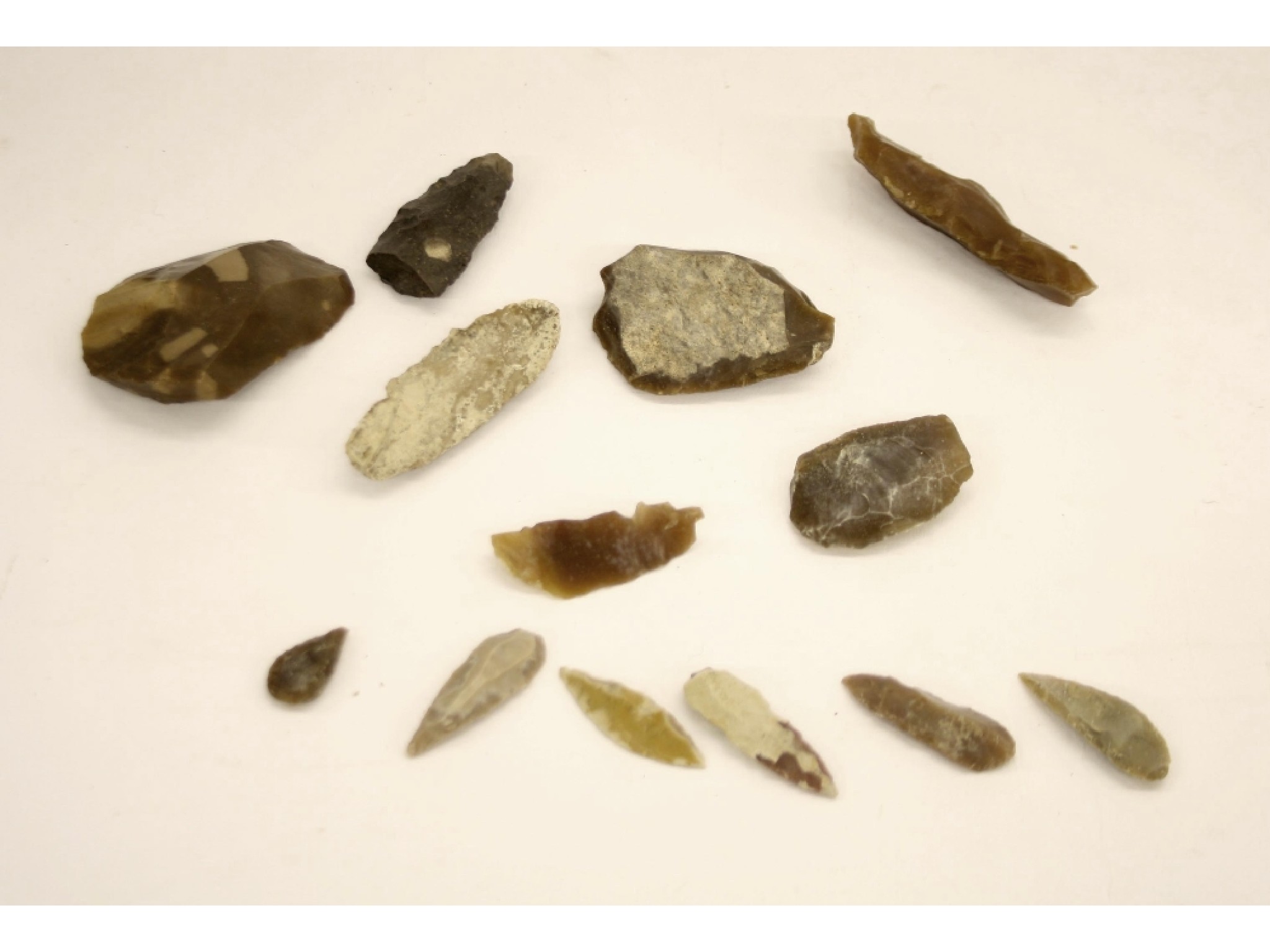 Appraisal: Collection of stone age diamond and triangular leaf shaped arrow