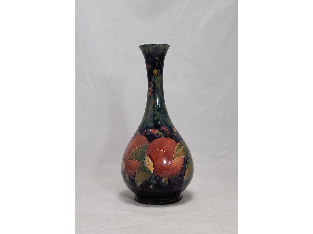 Appraisal: Moorcroft 'pomegranate' vase of onion form in muted reds orange