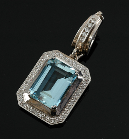 Appraisal: An aquamarine and diamond pendant enhancer The emerald cut aquamarine