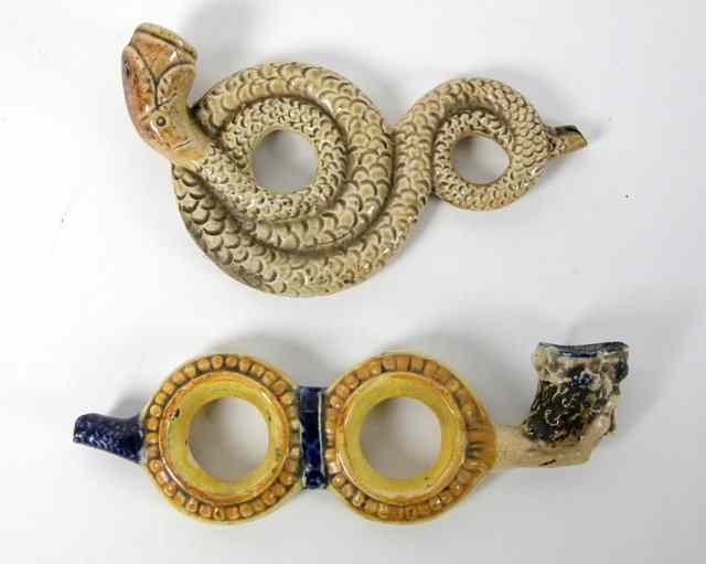 Appraisal: A Prattware pipe modelled as a coiled snake and another