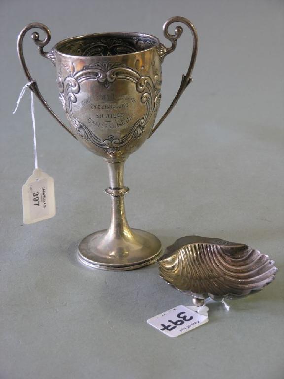 Appraisal: An embossed silver trophy with twin scroll handles Birmingham in