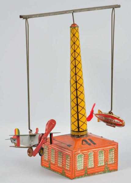 Appraisal: Tin Litho Marx Airplane Hanger Wind-Up Toy Description American Includes