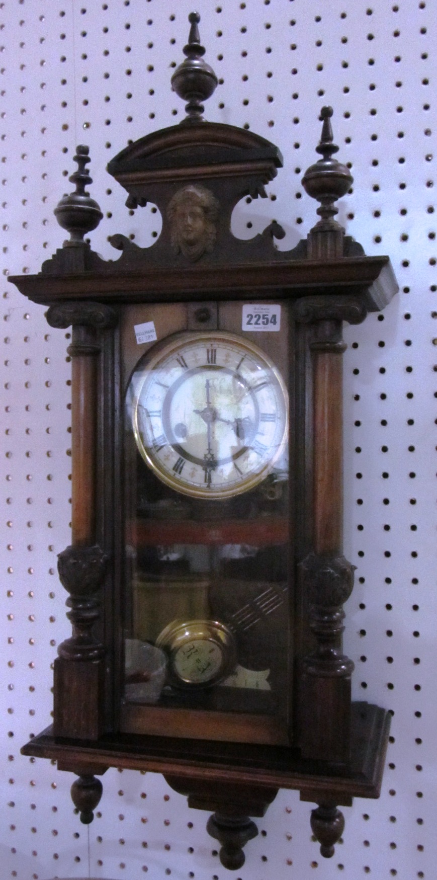 Appraisal: A walnut cased wall clock