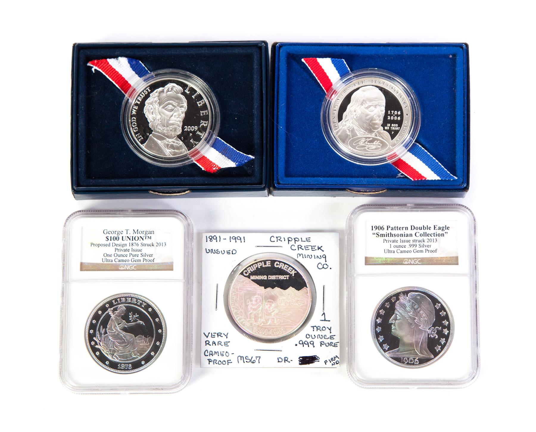 Appraisal: FIVE COMMEMORATIVE COINS American th century Two Smithsonian restrikes pattern