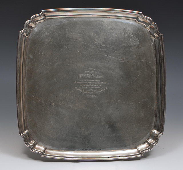 Appraisal: A SQUARE SILVER-PLATED SALVER with shaped corners presented to Mr