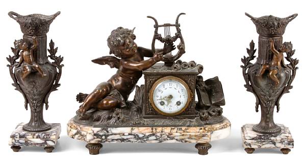 Appraisal: A Louis XVI style marble and spelter metal clock garniture