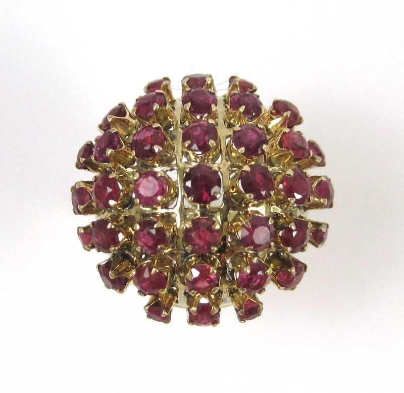 Appraisal: EIGHTEEN KARAT GOLD AND RUBY RING the dome shape ring