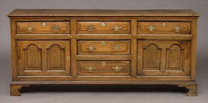 Appraisal: GEORGE III OAK DRESSER BASE The molded top above frieze