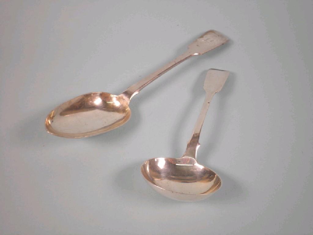 Appraisal: A Victorian silver fiddle pattern spoon Edinburgh and a Fiddle