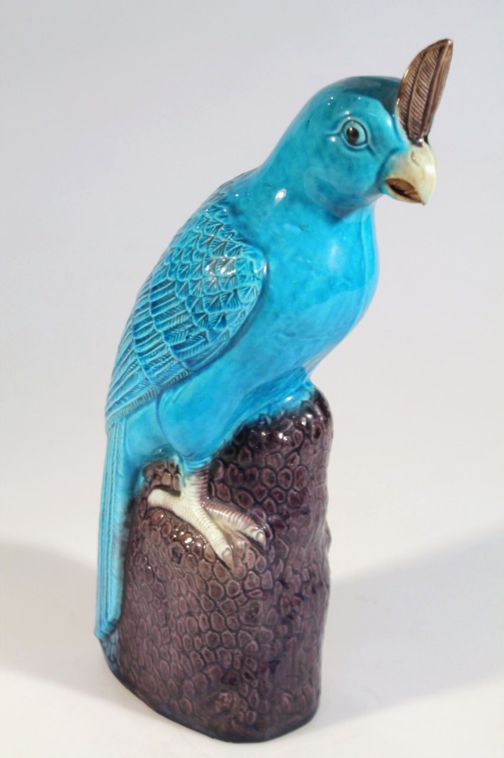 Appraisal: A thC Chinese pottery figure of a cockatoo on a