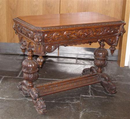 Appraisal: A Victorian oak carved table the rectangular top with canted